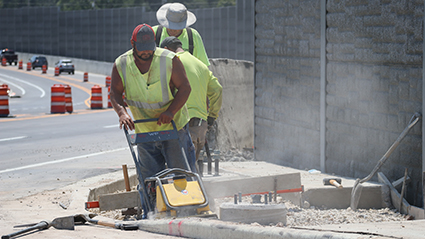 Three Construction workers at the I-43 North South project.