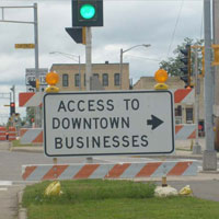 Access to downtown business baracade sign