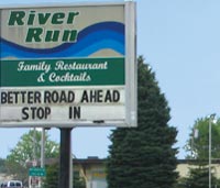 River Run restaurant sign, underneath it reads, "Better road ahead, stop in"