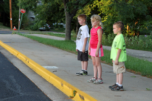 Kids standing at the curb