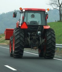 Farm tractor on highway