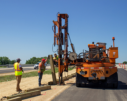 Workers install guardrail for the WIS 36 Burlington Bypass.