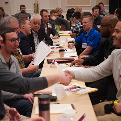Men shaking hands at the Annual DBE Workshop and Networking Summit