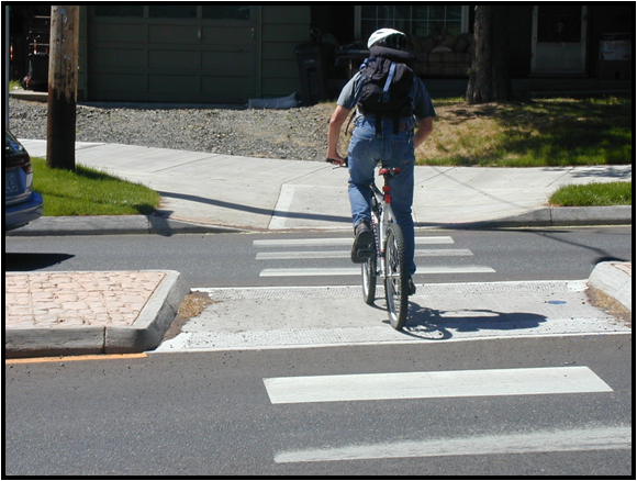 Bicyclist crossing street.