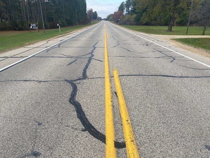 Road with cracks in pavement