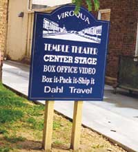 Sign that reads, "Viroqua, Temple Theater, Center Stage, Box Office Video, Box it-Pack it-Ship it, Dahl Travel"