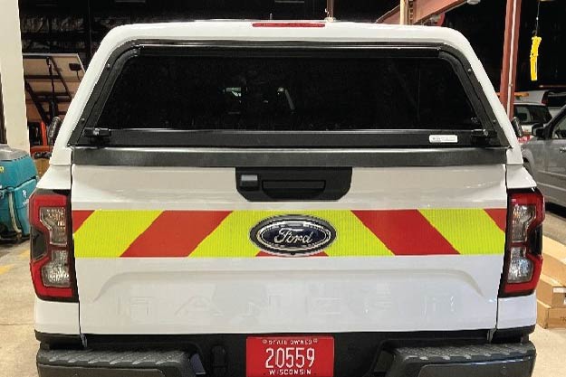 Image of worker vehicle with reflective striping