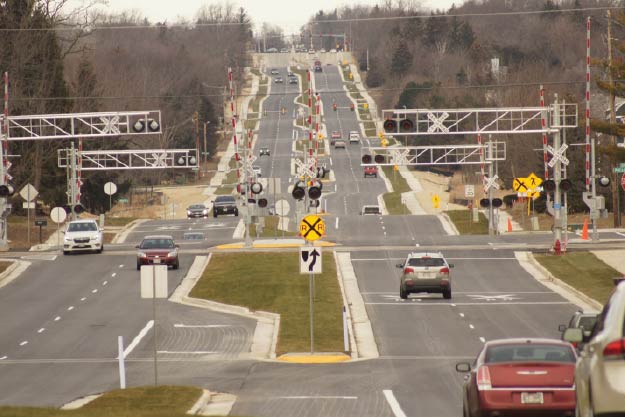 Image of multi-lane intersection with railroad crossing