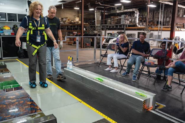 Image of WisDOT staff using the slip trip fall simulator