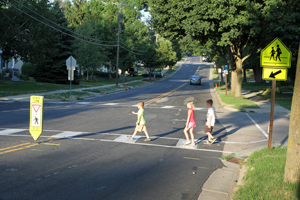 Children walking across a street