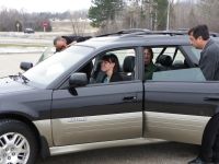 Carpoolers getting into a car